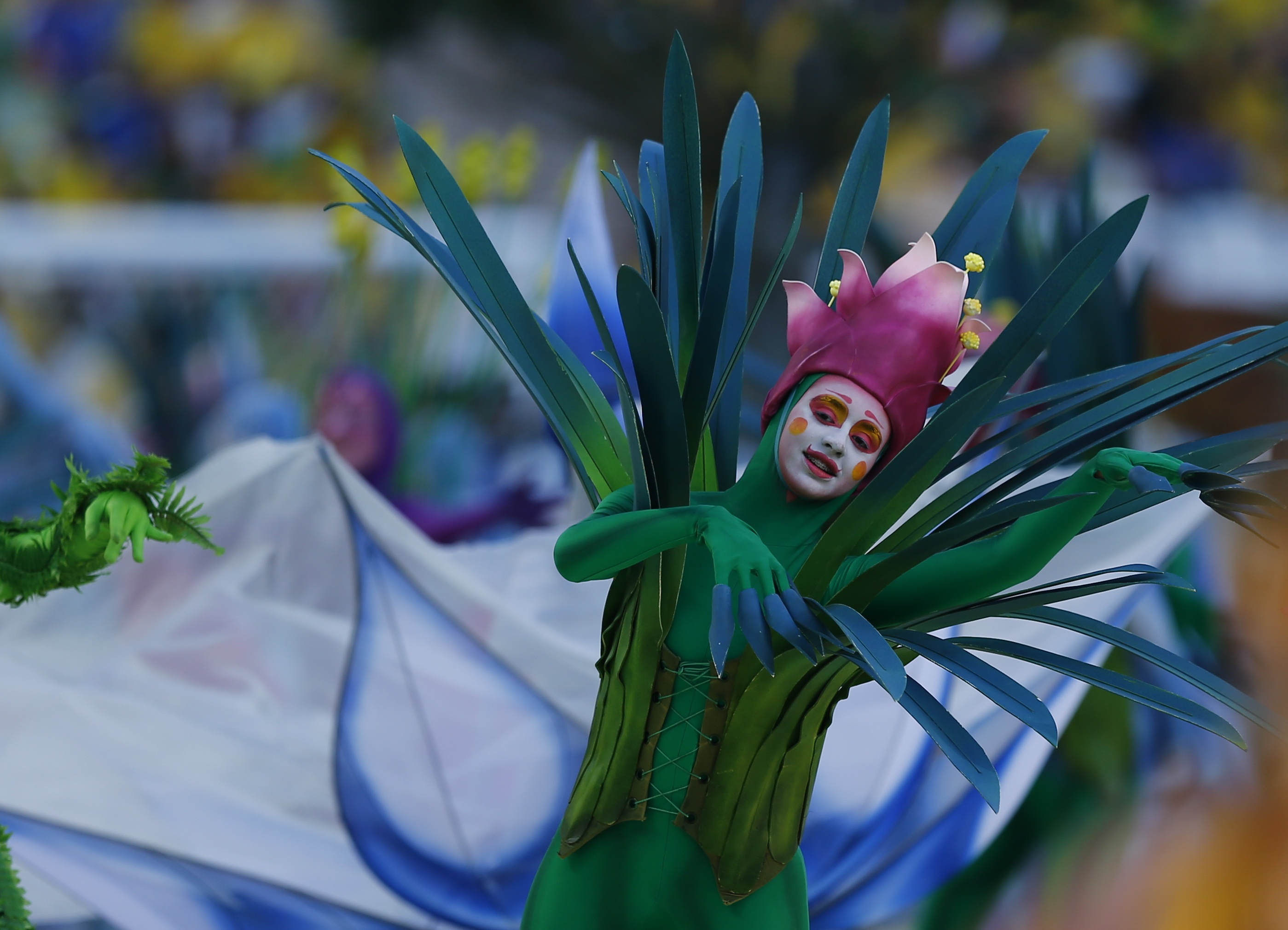 Performers dance during the 2014 World Cup opening ceremony at the Corinthians arena in Sao Paulo