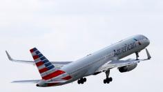 FILE PHOTO -  An American Airlines Boeing 757 aircraft takes off at the Charles de Gaulle airport in Roissy