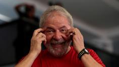 Former Brazilian President Luiz Inacio Lula da Silva reacts as he arrives at the metallurgical trade union while the Brazilian court decides on his appeal against a corruption conviction that could bar him from running in the 2018 presidential race, in S