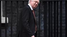 Britain's Secretary of State for Exiting the European Union David Davis walks out of 10 Downing Street in London