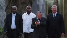 Cuba's President Raul Castro arrives for a ceremony to inaugurate a replica of New York's statue of Cuba's independence hero Marti in Havana