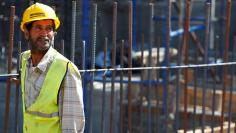 An Orascom's construction worker looks on at Egypt's new administrative capital, north of Cairo