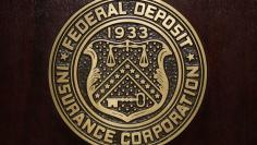 FILE PICTURE: The Federal Deposit Insurance Corp (FDIC) logo is seen at the FDIC headquarters as Chairman Sheila Bair announces the bank and thrift industry earnings for the fourth quarter 2010, in Washington, February 23, 2011.  REUTERS/Jason Reed  