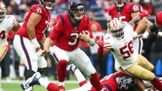 FILE PHOTO: Houston Texans quarterback Savage runs with the ball during the first quarter against the San Francisco 49ers in Houston