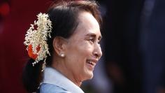 Myanmar's State Counsellor Aung San Suu Kyi smiles as she attends the "At Home" reception at the Rashtrapati Bhavan presidential palace after the Republic Day parade in New Delhi