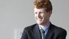 Massachusetts Congressional candidate Kennedy III laughs as he waits for Prime Minister of Ireland Kenny to arrive at John F. Kennedy Presidential Library and Museum in Boston