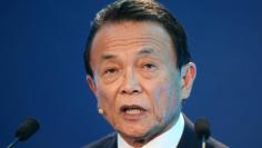 FILE PHOTO: Taro Aso, Deputy Prime Minister, Minister of Finance and Minister of State for Financial Services of Japan, speaks during the Milken Institute Global Conference in Beverly Hills, California, U.S., May 1, 2017. REUTERS/Lucy Nicholson/File Phot