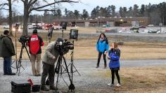 A reporter speaks to a camera at the scene of a shooting at Marshall County High School in Benton, Kentucky, U.S., January 23, 2018.   REUTERS/Harrison McClary