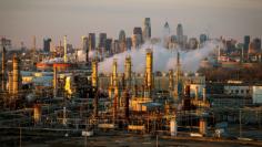 FILE PHOTO: The Philadelphia Energy Solutions oil refinery owned by The Carlyle Group is seen at sunset in front of the Philadelphia skyline March 24, 2014.  REUTERS/David M. Parrott/File Photo 