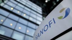 FILE PHOTO: A logo is seen in front of the entrance at the headquarters of French drugmaker Sanofi in Paris