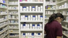 A pharmacy employee works to fill a prescription in New York. REUTERS/Lucas Jackson 