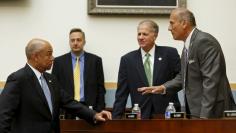 FILE PHOTO: U.S. Homeland Security Secretary Jeh Johnson (L) listens to Representative Tom Marino (R-PA) (R) before a House Judiciary committee hearing on the 'Oversight of the US Department of Homeland Security' on Capitol Hill in Washington July 14, 20