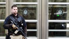 FILE PHOTO - An armed U.S. Marshall stands outside federal court in Brooklyn before the court appearance of Tairod Nathan Webster Pugh, of Neptune, New Jersey, in the borough of Brooklyn in New York