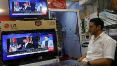 An Afghan man watches the TV broadcast of the U.S. President Donald Trump's speech, in Kabul, Afghanistan August 22, 2017. REUTERS/Omar Sobhani