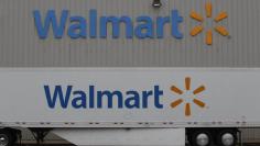 The Wal-Mart company logo is seen outside a Wal-Mart Stores Inc company distribution center in Bentonville, Arkansas June 6, 2013.  REUTERS/Rick Wilking (UNITED STATES  - Tags: BUSINESS)  